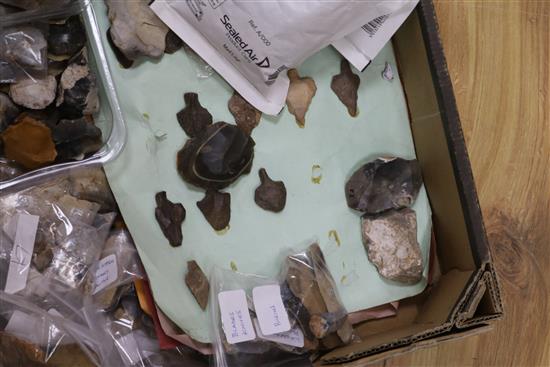 A stone fishing/loom weight and a large collection of prehistoric flint tools,